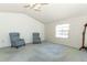 Large bedroom showcasing wallpaper, a ceiling fan, and windows offering plenty of natural light at 7703 Pine Vista Ct, Orlando, FL 32819