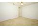 Neutral bedroom features carpet, ceiling fan, and closet at 7703 Pine Vista Ct, Orlando, FL 32819