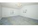 Spacious bedroom with vaulted ceiling and dual windows allowing ample natural light at 7703 Pine Vista Ct, Orlando, FL 32819