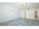 Large bedroom featuring vaulted ceiling, carpet and an ensuite bath at 7703 Pine Vista Ct, Orlando, FL 32819