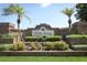 Entrance to Hidden Springs featuring a brick wall, landscaping, and a clear community sign at 7703 Pine Vista Ct, Orlando, FL 32819