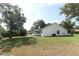 Exterior backyard view, showing the side and back of the house at 7703 Pine Vista Ct, Orlando, FL 32819