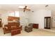 Bright living room featuring high ceilings, built in shelving and a pass-through kitchen bar at 7703 Pine Vista Ct, Orlando, FL 32819