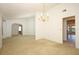 Spacious carpeted living room with arched doorways and natural light at 7703 Pine Vista Ct, Orlando, FL 32819