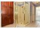 Bathroom highlighting a glass shower with golden fixtures and a built-in seat at 7703 Pine Vista Ct, Orlando, FL 32819