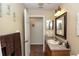 Bathroom with vanity, framed mirror, and neutral color scheme at 825 White Birch Ct, Orange City, FL 32763