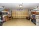 Spacious garage with ample storage space and an overhead door for easy access at 825 White Birch Ct, Orange City, FL 32763