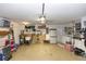 Spacious garage with ample storage space, laundry area, and organized shelving at 825 White Birch Ct, Orange City, FL 32763