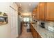 Kitchen with pantry access and a view of the breakfast nook at 825 White Birch Ct, Orange City, FL 32763