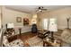 Inviting living room with hardwood floors and an open layout to the kitchen at 825 White Birch Ct, Orange City, FL 32763
