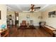 Open living space with hardwood floors, neutral walls, and lots of light at 825 White Birch Ct, Orange City, FL 32763