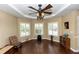 Cozy room with hardwood floors, white shutters, and recessed ceilings and fan at 825 White Birch Ct, Orange City, FL 32763