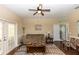 Relaxing living room with comfortable seating, hardwood floors, and access to the outside at 825 White Birch Ct, Orange City, FL 32763