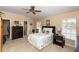 Comfortable main bedroom with a ceiling fan and private bathroom at 825 White Birch Ct, Orange City, FL 32763
