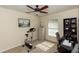 Well-lit office space with a ceiling fan, ideal for productivity and focus at 825 White Birch Ct, Orange City, FL 32763