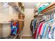 Walk-in closet with built in shelving and racks for ample storage at 825 White Birch Ct, Orange City, FL 32763