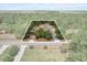 Aerial shot of property showcasing a home in the middle of a tree-lined area at 8660 Sw 137Th Ct, Dunnellon, FL 34432