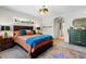 Bright bedroom features a large window and colorful rug at 8660 Sw 137Th Ct, Dunnellon, FL 34432