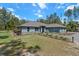 Beautiful single-story home with manicured landscaping and a lovely driveway at 8660 Sw 137Th Ct, Dunnellon, FL 34432
