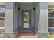A welcoming home featuring decorative stone accents and a covered front porch at 8660 Sw 137Th Ct, Dunnellon, FL 34432
