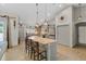 Bright kitchen featuring a large island with seating, modern appliances, and stylish pendant lighting at 8660 Sw 137Th Ct, Dunnellon, FL 34432