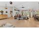 Open living area with elegant furniture, decorative fixtures, and arched entryway with a seamless flow at 8660 Sw 137Th Ct, Dunnellon, FL 34432