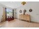 Tastefully decorated living room featuring a console table and a large window bringing in natural light at 8660 Sw 137Th Ct, Dunnellon, FL 34432