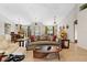 Well-appointed living room and dining area with a comfortable seating arrangement and modern lighting fixtures at 8660 Sw 137Th Ct, Dunnellon, FL 34432
