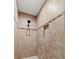 Modern shower featuring sleek tilework, a shower niche, and a contemporary showerhead at 8660 Sw 137Th Ct, Dunnellon, FL 34432
