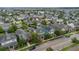 Aerial view featuring the community's colorful homes and well-manicured lawns along the road at 8679 Laureate Blvd, Orlando, FL 32827