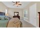 Serene bedroom with a comfortable bed, dresser, and soft natural light, perfect for rest and relaxation after a long day at 8679 Laureate Blvd, Orlando, FL 32827