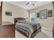 Cozy bedroom featuring a comfortable bed, neutral walls, and a ceiling fan at 8679 Laureate Blvd, Orlando, FL 32827