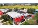 An aerial view showcases the unique and vibrant Boxi Park, offering an outdoor entertainment and dining experience at 8679 Laureate Blvd, Orlando, FL 32827