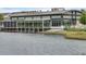 Waterfront restaurant featuring stylish design and abundant natural light from large windows and inviting lakeside views at 8679 Laureate Blvd, Orlando, FL 32827