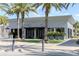 Striking building featuring modern architecture, lush plants, and sleek entrance, promising a contemporary experience at 8679 Laureate Blvd, Orlando, FL 32827