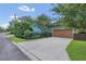 Charming home featuring a spacious driveway and a well-manicured lawn at 8679 Laureate Blvd, Orlando, FL 32827