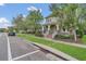 Beautiful two-story home with a welcoming front porch and well-maintained landscaping at 8679 Laureate Blvd, Orlando, FL 32827