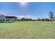 Expansive green space with a pavilion and surrounding residential architecture offers a vibrant community gathering space at 8679 Laureate Blvd, Orlando, FL 32827