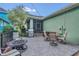 A spacious patio with a fire pit, grilling station, and outdoor dining with easy access to the screened lanai at 8679 Laureate Blvd, Orlando, FL 32827