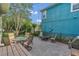 A brick-paved patio offers outdoor dining and relaxation with views of the fenced yard and landscaping at 8679 Laureate Blvd, Orlando, FL 32827