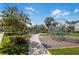 Community playground with modern climbing structures and lush landscaping creates a safe and engaging environment at 8679 Laureate Blvd, Orlando, FL 32827