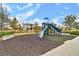 Community playground with a slide, swings, and modern design elements ensures endless fun in a Gathering-friendly setting at 8679 Laureate Blvd, Orlando, FL 32827