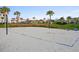 Community sand volleyball court with a net and seating, perfect for recreational games at 8679 Laureate Blvd, Orlando, FL 32827