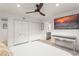 Bedroom featuring a TV, double closets, and an ensuite bathroom at 8988 Houston Pl # 303, Orlando, FL 32819