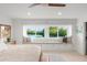 Inviting bedroom featuring a window seat with lake views, adding charm and relaxation at 8988 Houston Pl # 303, Orlando, FL 32819