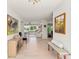 Bright hallway featuring elegant decor and seamless flow to living spaces at 8988 Houston Pl # 303, Orlando, FL 32819