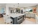 Beautiful kitchen with modern appliances, a large island, and ample storage space at 8988 Houston Pl # 303, Orlando, FL 32819