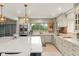 Spacious kitchen with custom cabinets, stainless steel appliances, and quartz countertops at 8988 Houston Pl # 303, Orlando, FL 32819