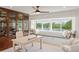 Cozy office with custom built-ins, a window seat, and serene water views at 8988 Houston Pl # 303, Orlando, FL 32819