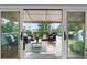 Covered patio featuring comfortable seating, perfect for outdoor relaxation with a view at 8988 Houston Pl # 303, Orlando, FL 32819